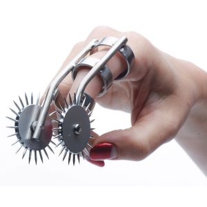 Now you can always have sensation play at the tip of your finger This unique take on a Wartenberg Wheel allows you to wear two pinwheels on a ring-like device. The smooth rolling motion upon your lovers skin will produce a prickly