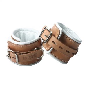 Lock your sub down in these stylish and comfortable Strict Leather Padded Hospital Style Cuffs. Made from high quality light brown leather with padding on the inside lined with white leather for superior comfort. Each set has 5 notches so you have a wide range to find the perfect fit. You can rest assure that when you place you sub in these cuffs