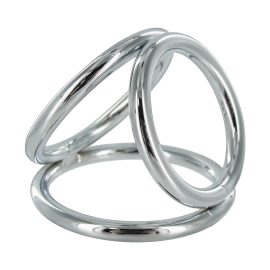 The Triad Chamber brings the art of domination in threes. This chrome cock cage features three differently sized O-rings with which you can ensnare your pet. The largest ring goes around the cock and balls like a normal cock ring. The middle sized ring goes around the balls